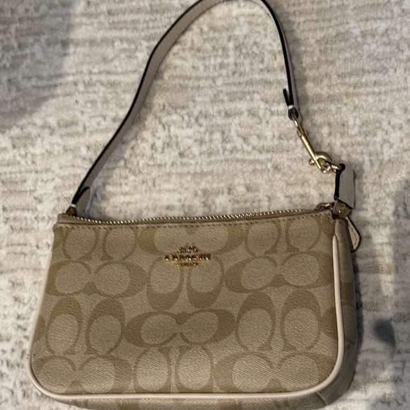 Coach Handbags - Coach Tan Signature Shoulder Bag
Brand new worn once
